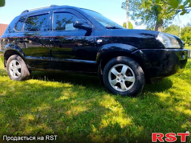 Черный Хендай Туксон, объемом двигателя 2 л и пробегом 230 тыс. км за 8000 $, фото 1 на Automoto.ua