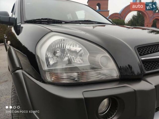 Черный Хендай Туксон, объемом двигателя 1.98 л и пробегом 182 тыс. км за 8150 $, фото 43 на Automoto.ua