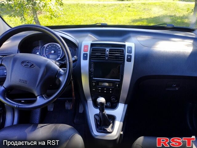 Черный Хендай Туксон, объемом двигателя 2 л и пробегом 230 тыс. км за 8000 $, фото 6 на Automoto.ua