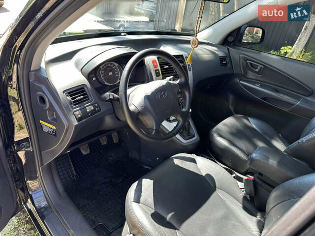 Чорний Хендай Туксон, об'ємом двигуна 2 л та пробігом 165 тис. км за 8500 $, фото 5 на Automoto.ua