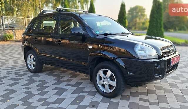 Черный Хендай Туксон, объемом двигателя 2 л и пробегом 190 тыс. км за 8150 $, фото 6 на Automoto.ua