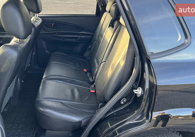 Черный Хендай Туксон, объемом двигателя 1.98 л и пробегом 243 тыс. км за 8500 $, фото 35 на Automoto.ua