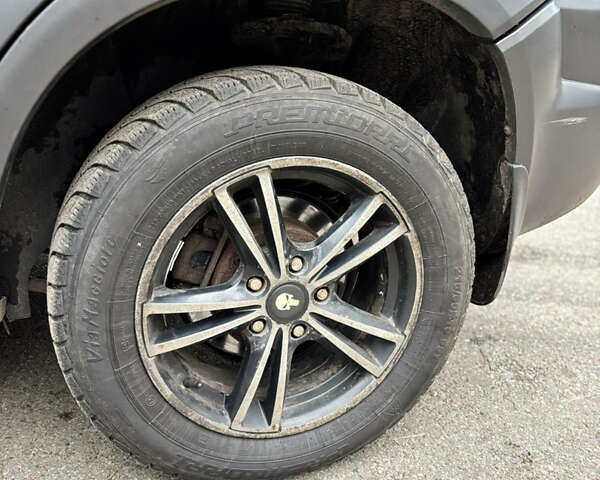 Черный Хендай Туксон, объемом двигателя 1.99 л и пробегом 266 тыс. км за 7500 $, фото 6 на Automoto.ua