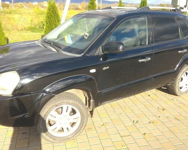 Черный Хендай Туксон, объемом двигателя 2 л и пробегом 277 тыс. км за 7900 $, фото 6 на Automoto.ua