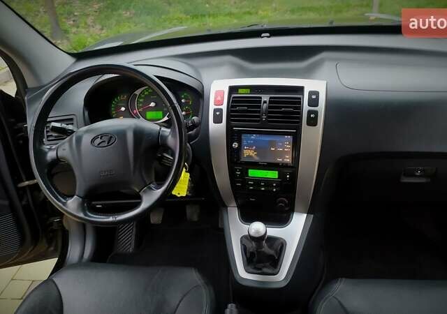 Чорний Хендай Туксон, об'ємом двигуна 2 л та пробігом 229 тис. км за 8600 $, фото 113 на Automoto.ua