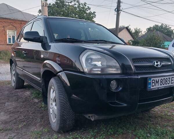 Черный Хендай Туксон, объемом двигателя 1.98 л и пробегом 200 тыс. км за 7100 $, фото 2 на Automoto.ua