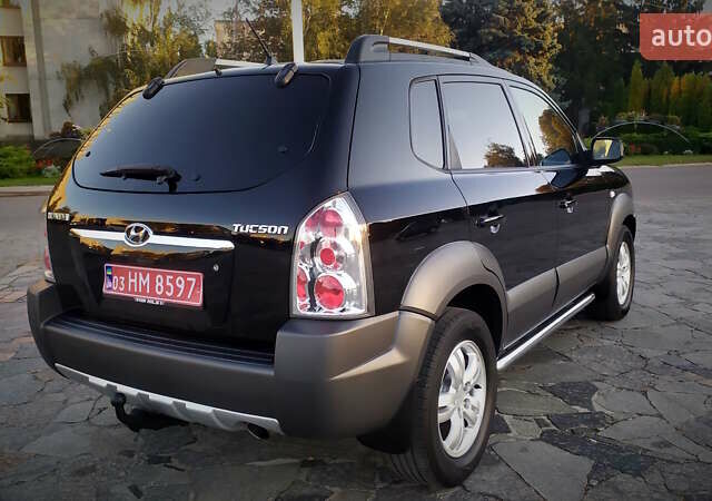 Черный Хендай Туксон, объемом двигателя 2 л и пробегом 230 тыс. км за 8600 $, фото 40 на Automoto.ua