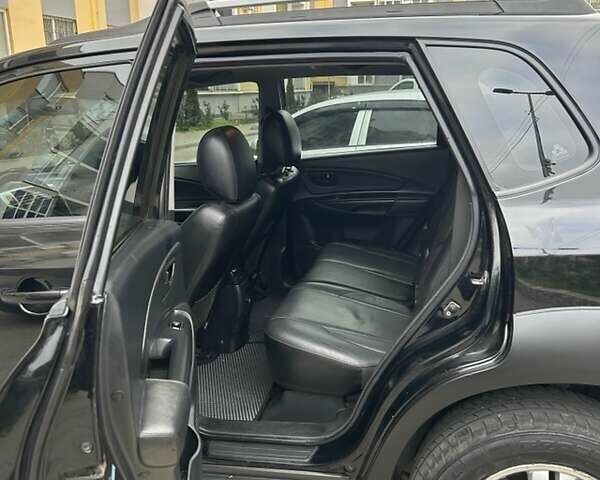 Черный Хендай Туксон, объемом двигателя 1.98 л и пробегом 147 тыс. км за 8000 $, фото 3 на Automoto.ua