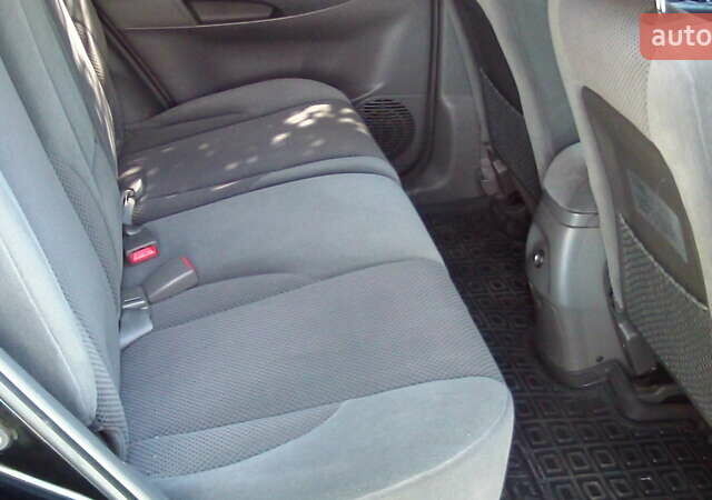 Черный Хендай Туксон, объемом двигателя 1.98 л и пробегом 234 тыс. км за 7800 $, фото 8 на Automoto.ua