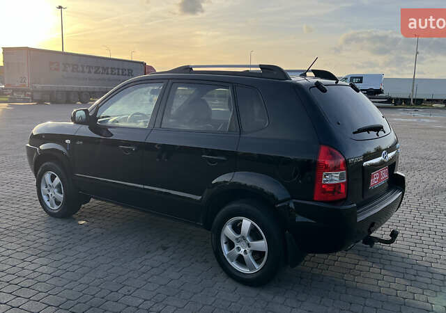 Черный Хендай Туксон, объемом двигателя 1.98 л и пробегом 243 тыс. км за 8500 $, фото 14 на Automoto.ua