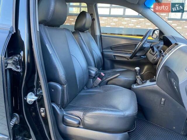 Черный Хендай Туксон, объемом двигателя 1.98 л и пробегом 286 тыс. км за 7300 $, фото 18 на Automoto.ua