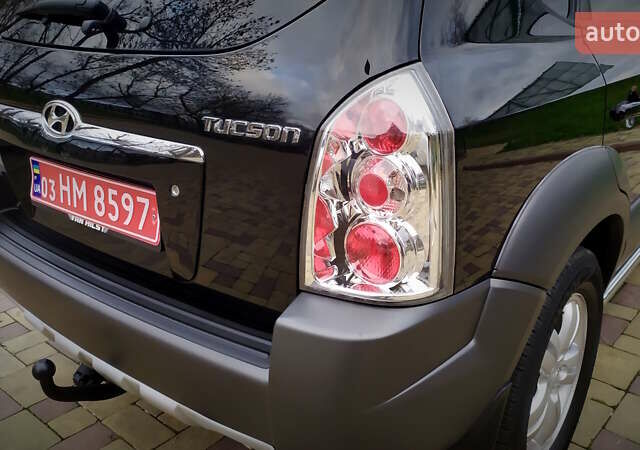 Чорний Хендай Туксон, об'ємом двигуна 2 л та пробігом 229 тис. км за 8600 $, фото 76 на Automoto.ua