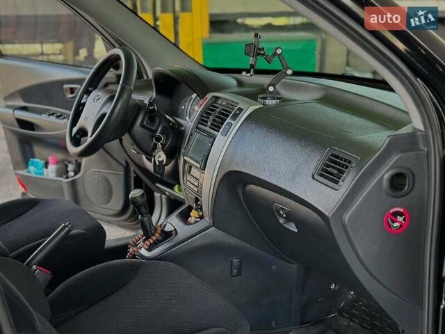 Черный Хендай Туксон, объемом двигателя 2 л и пробегом 310 тыс. км за 6499 $, фото 10 на Automoto.ua