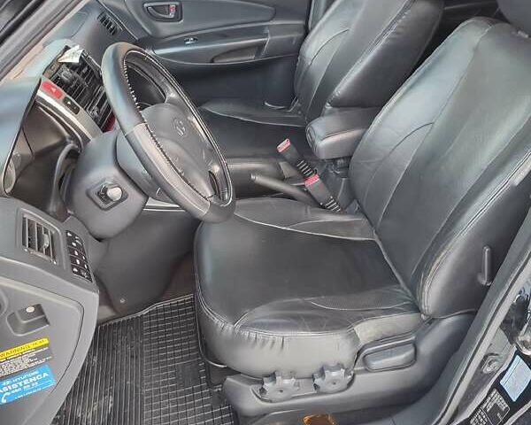 Черный Хендай Туксон, объемом двигателя 1.98 л и пробегом 335 тыс. км за 7800 $, фото 3 на Automoto.ua