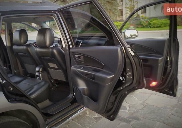 Черный Хендай Туксон, объемом двигателя 2 л и пробегом 230 тыс. км за 8600 $, фото 178 на Automoto.ua
