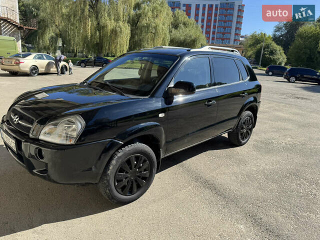 Черный Хендай Туксон, объемом двигателя 2 л и пробегом 189 тыс. км за 8250 $, фото 14 на Automoto.ua