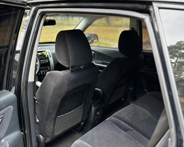 Черный Хендай Туксон, объемом двигателя 1.99 л и пробегом 266 тыс. км за 7500 $, фото 9 на Automoto.ua