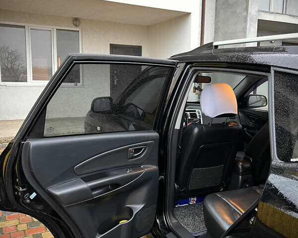 Черный Хендай Туксон, объемом двигателя 2 л и пробегом 151 тыс. км за 9100 $, фото 14 на Automoto.ua