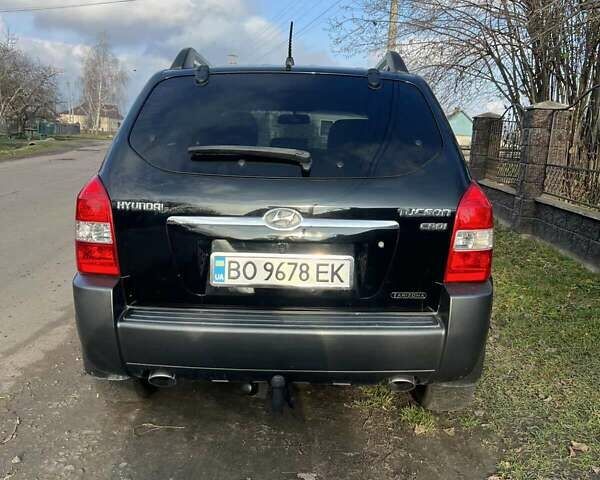 Черный Хендай Туксон, объемом двигателя 1.99 л и пробегом 302 тыс. км за 6900 $, фото 12 на Automoto.ua