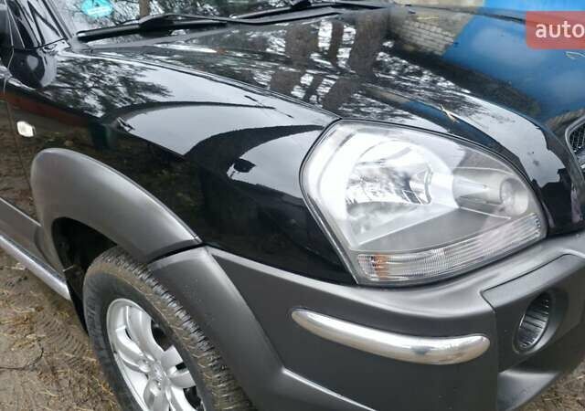 Чорний Хендай Туксон, об'ємом двигуна 2 л та пробігом 207 тис. км за 8200 $, фото 14 на Automoto.ua