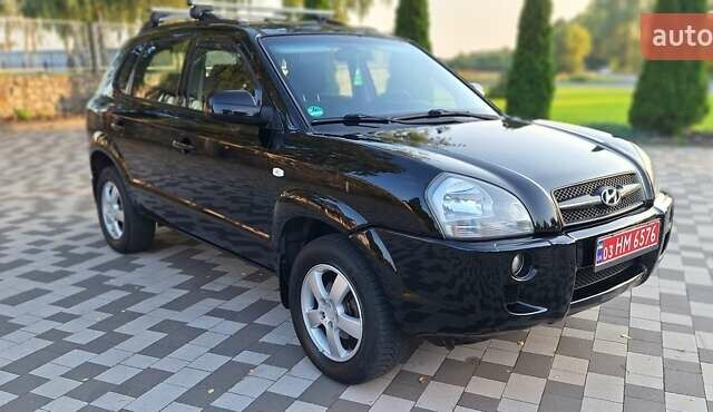 Черный Хендай Туксон, объемом двигателя 2 л и пробегом 190 тыс. км за 8150 $, фото 17 на Automoto.ua