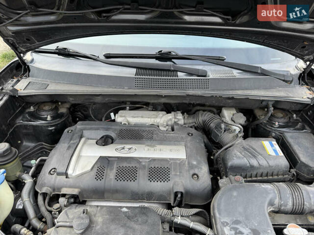 Черный Хендай Туксон, объемом двигателя 1.98 л и пробегом 159 тыс. км за 7600 $, фото 39 на Automoto.ua