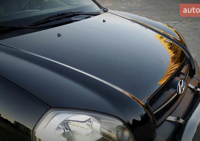 Черный Хендай Туксон, объемом двигателя 2 л и пробегом 230 тыс. км за 8600 $, фото 49 на Automoto.ua