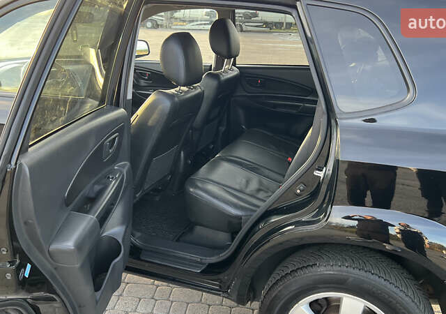 Черный Хендай Туксон, объемом двигателя 1.98 л и пробегом 243 тыс. км за 8500 $, фото 31 на Automoto.ua