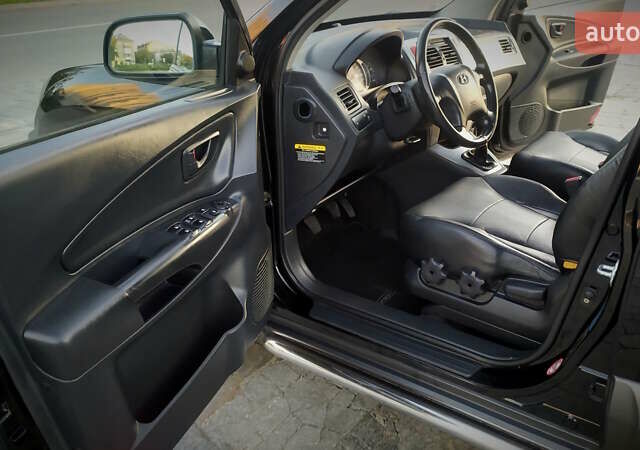 Черный Хендай Туксон, объемом двигателя 2 л и пробегом 230 тыс. км за 8600 $, фото 137 на Automoto.ua