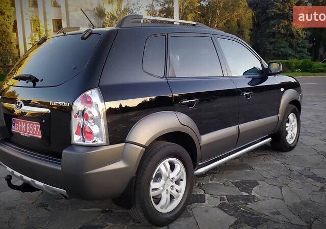 Черный Хендай Туксон, объемом двигателя 2 л и пробегом 230 тыс. км за 8600 $, фото 39 на Automoto.ua