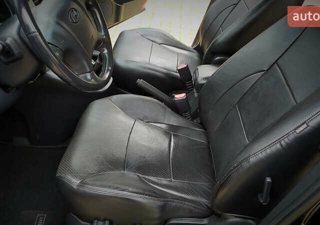 Чорний Хендай Туксон, об'ємом двигуна 2 л та пробігом 229 тис. км за 8600 $, фото 106 на Automoto.ua