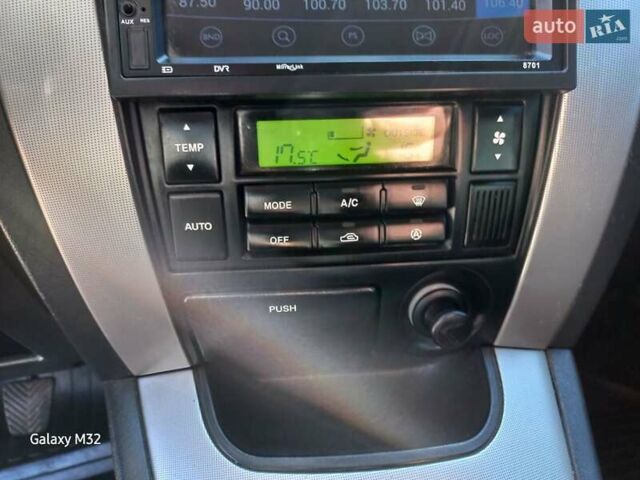 Черный Хендай Туксон, объемом двигателя 2 л и пробегом 219 тыс. км за 8500 $, фото 12 на Automoto.ua