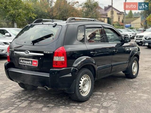 Черный Хендай Туксон, объемом двигателя 2 л и пробегом 177 тыс. км за 8940 $, фото 4 на Automoto.ua