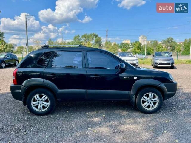Черный Хендай Туксон, объемом двигателя 2 л и пробегом 227 тыс. км за 8200 $, фото 6 на Automoto.ua