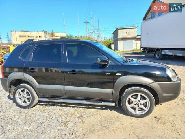 Черный Хендай Туксон, объемом двигателя 2 л и пробегом 219 тыс. км за 8500 $, фото 1 на Automoto.ua