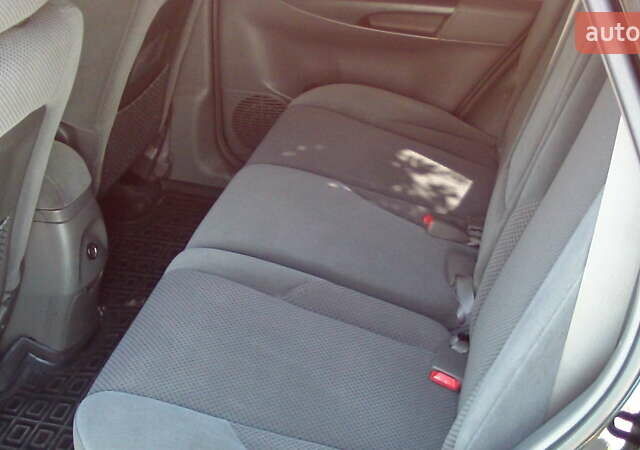 Черный Хендай Туксон, объемом двигателя 1.98 л и пробегом 234 тыс. км за 7800 $, фото 3 на Automoto.ua