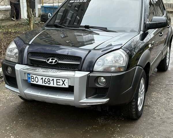 Черный Хендай Туксон, объемом двигателя 1.98 л и пробегом 273 тыс. км за 7400 $, фото 1 на Automoto.ua