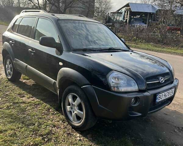 Черный Хендай Туксон, объемом двигателя 1.99 л и пробегом 302 тыс. км за 6900 $, фото 9 на Automoto.ua