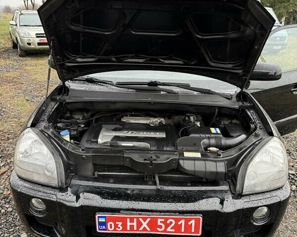Чорний Хендай Туксон, об'ємом двигуна 2 л та пробігом 196 тис. км за 7250 $, фото 26 на Automoto.ua