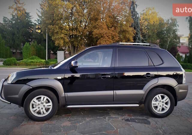 Черный Хендай Туксон, объемом двигателя 2 л и пробегом 230 тыс. км за 8600 $, фото 99 на Automoto.ua