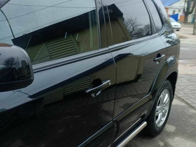 Черный Хендай Туксон, объемом двигателя 2 л и пробегом 200 тыс. км за 8300 $, фото 2 на Automoto.ua