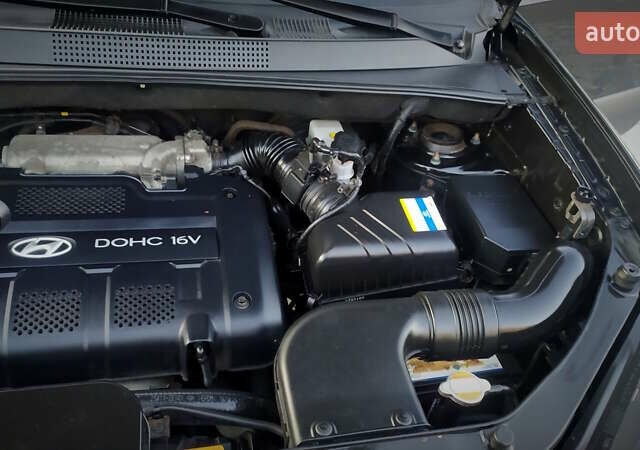 Черный Хендай Туксон, объемом двигателя 2 л и пробегом 230 тыс. км за 8600 $, фото 206 на Automoto.ua