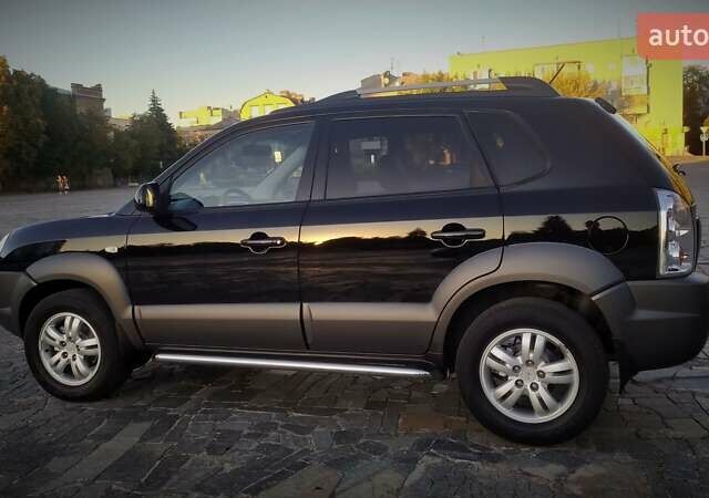 Черный Хендай Туксон, объемом двигателя 2 л и пробегом 230 тыс. км за 8600 $, фото 11 на Automoto.ua