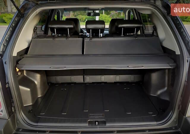 Черный Хендай Туксон, объемом двигателя 2 л и пробегом 230 тыс. км за 8600 $, фото 130 на Automoto.ua