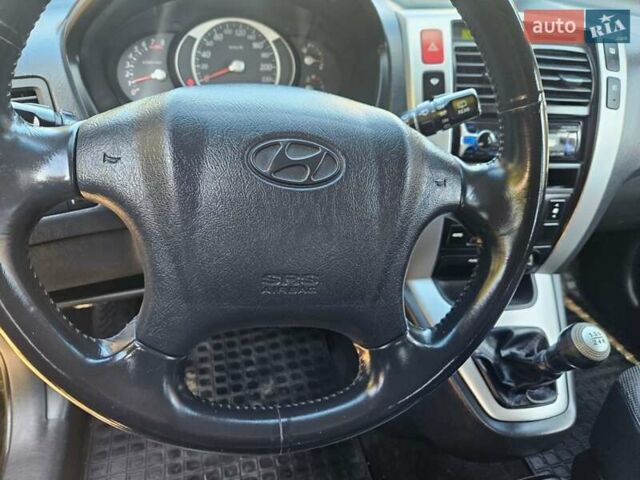 Чорний Хендай Туксон, об'ємом двигуна 2 л та пробігом 152 тис. км за 7950 $, фото 14 на Automoto.ua