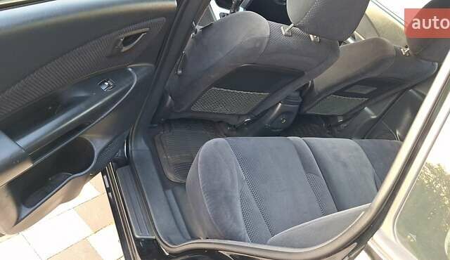 Черный Хендай Туксон, объемом двигателя 2 л и пробегом 190 тыс. км за 8150 $, фото 24 на Automoto.ua