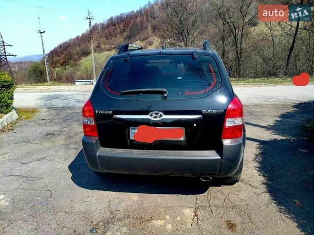 Черный Хендай Туксон, объемом двигателя 2 л и пробегом 218 тыс. км за 7700 $, фото 2 на Automoto.ua