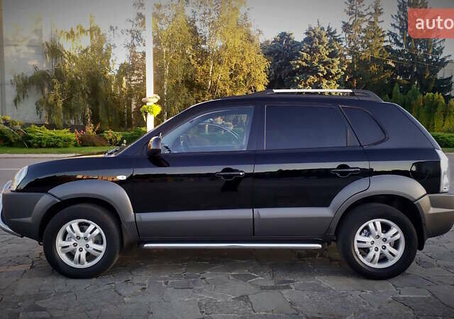 Черный Хендай Туксон, объемом двигателя 2 л и пробегом 230 тыс. км за 8600 $, фото 5 на Automoto.ua