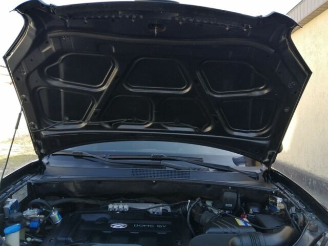 Черный Хендай Туксон, объемом двигателя 2 л и пробегом 211 тыс. км за 7500 $, фото 17 на Automoto.ua
