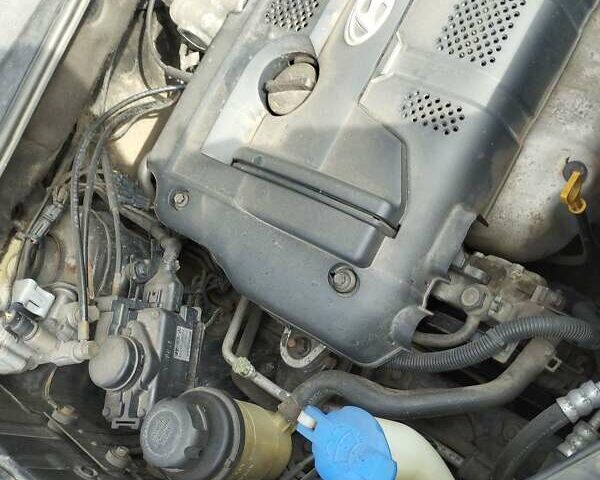 Черный Хендай Туксон, объемом двигателя 2 л и пробегом 250 тыс. км за 7500 $, фото 6 на Automoto.ua